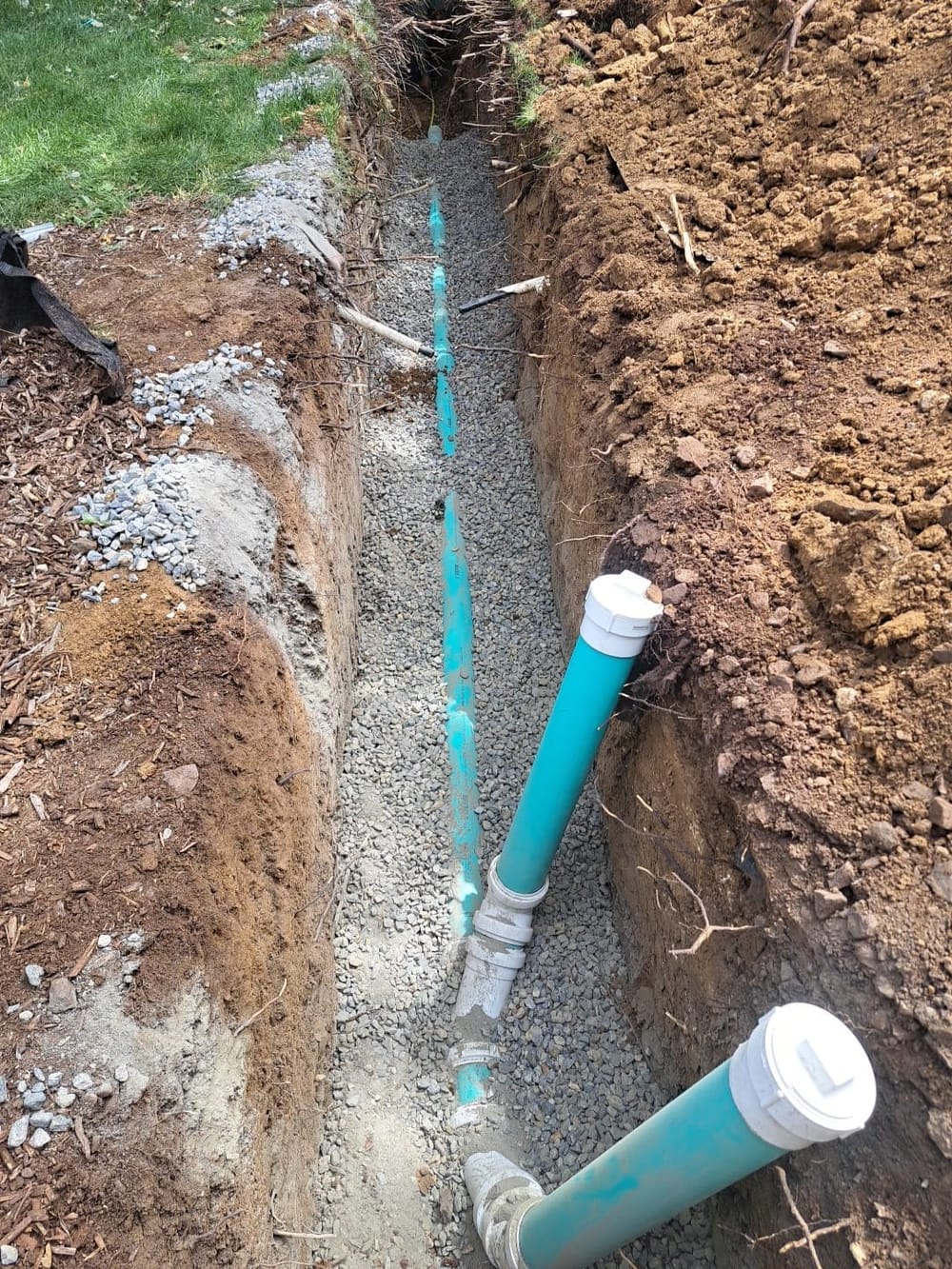 Sewer line installation in ground.