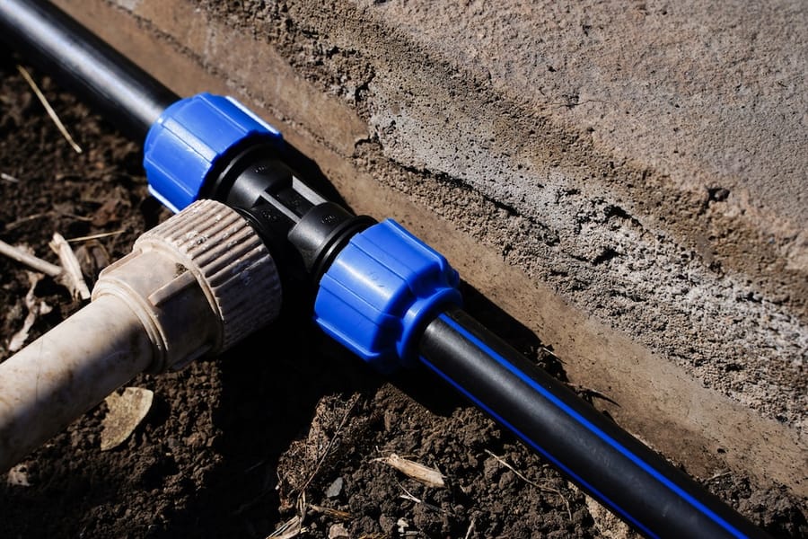 Blue water line installed underground.